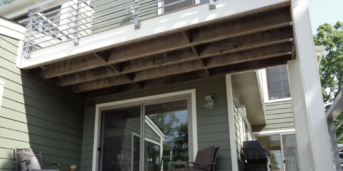 Exposed joists beneath a deck before installation