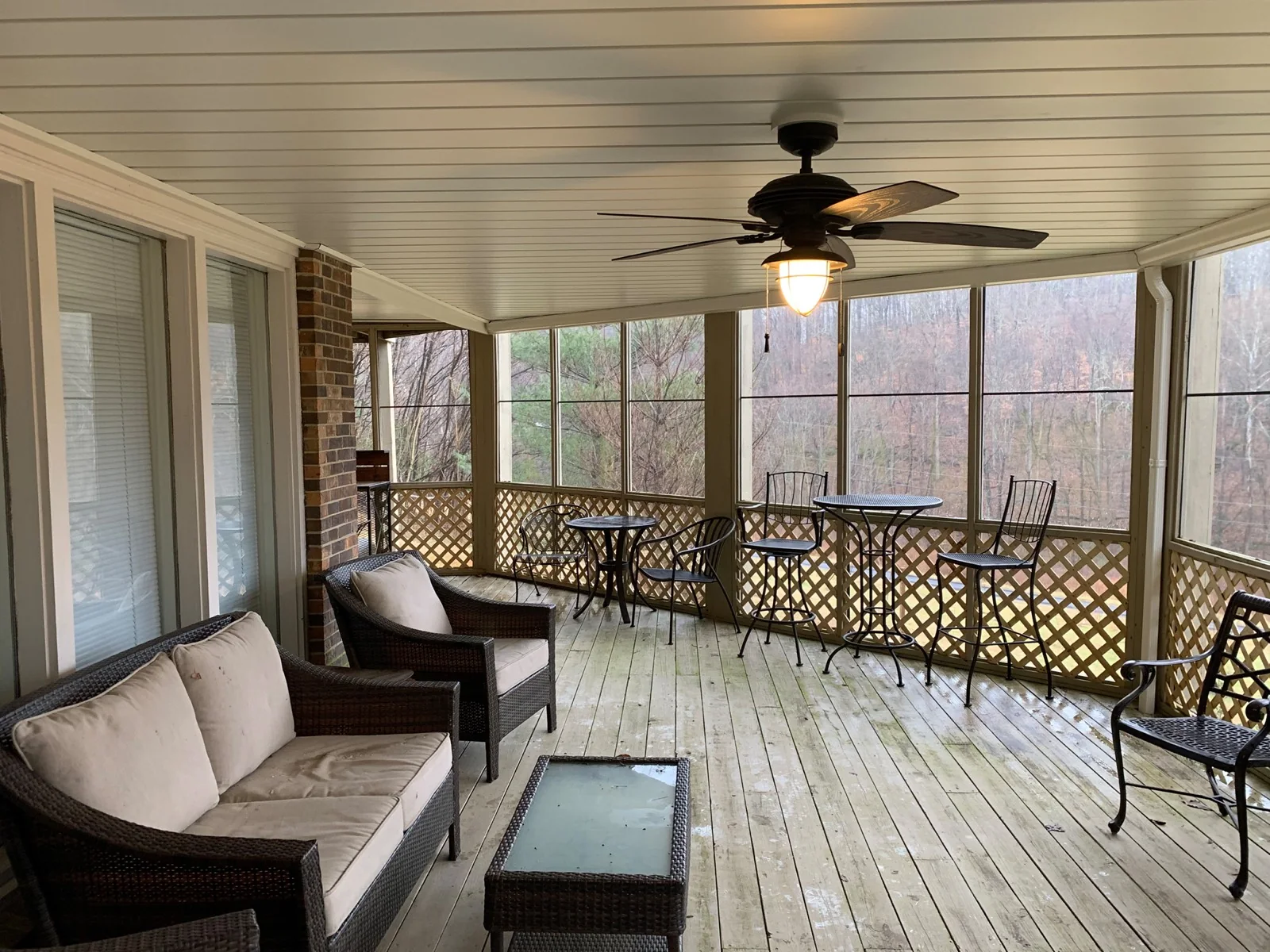 A protected three-season room beneath a deck